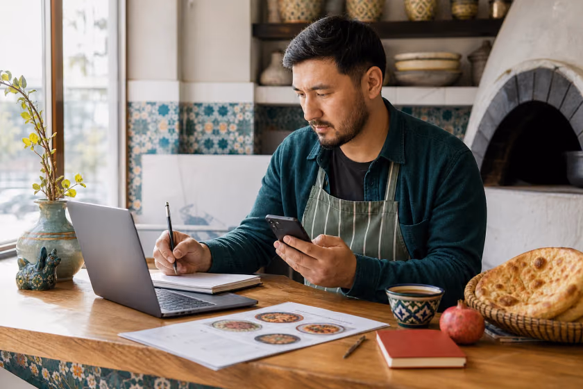 An independent restaurant owner reviewing business information before service